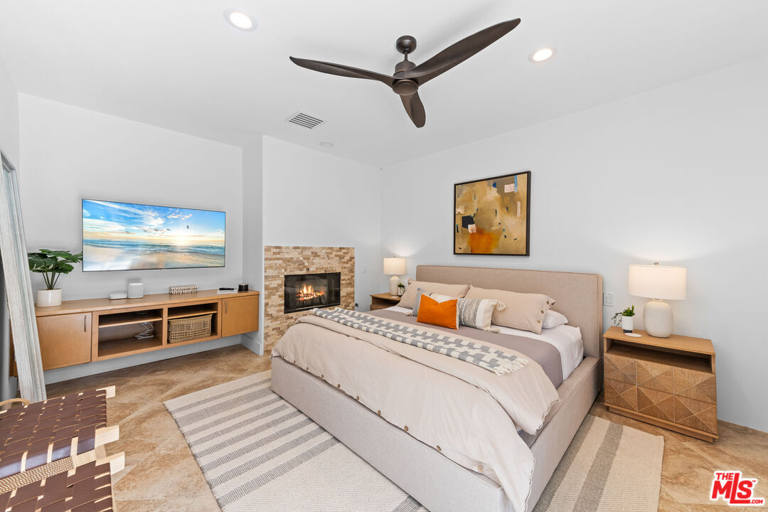 79400 Stonegate La Quinta, CA 92253 - Photo 25 of 46 a bedroom with a bed and a flat screen tv