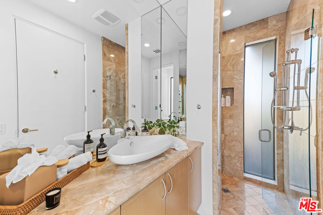 79400 Stonegate La Quinta, CA 92253 - Photo 29 of 46 a bathroom with a granite countertop sink and a mirror