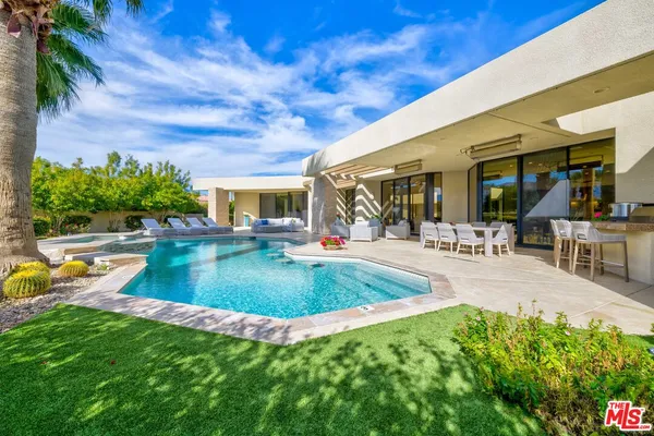 a view of a swimming pool with a patio