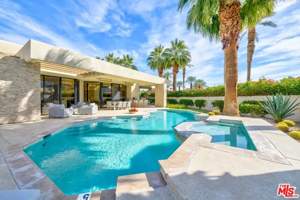 a view of a swimming pool with a patio