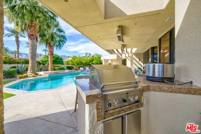 a view of a kitchen with swimming pool