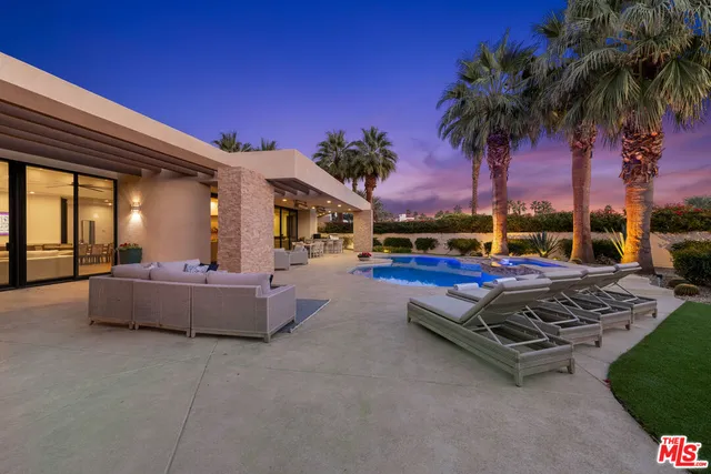 a view of outdoor space with swimming pool and patio