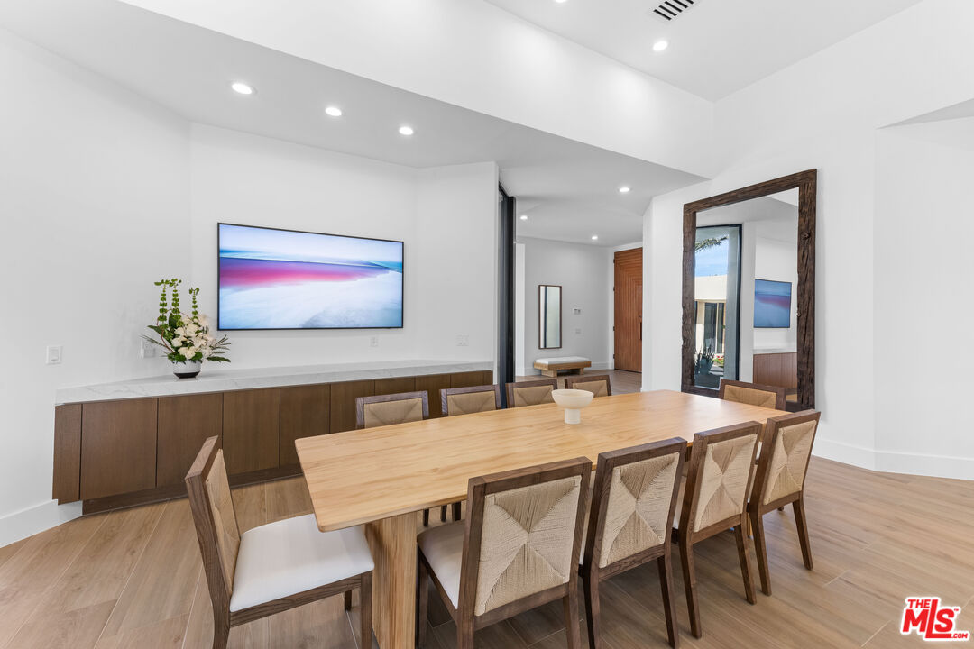 79400 Stonegate La Quinta, CA 92253 - Photo 6 of 46 a view of a dining room with furniture and wooden floor