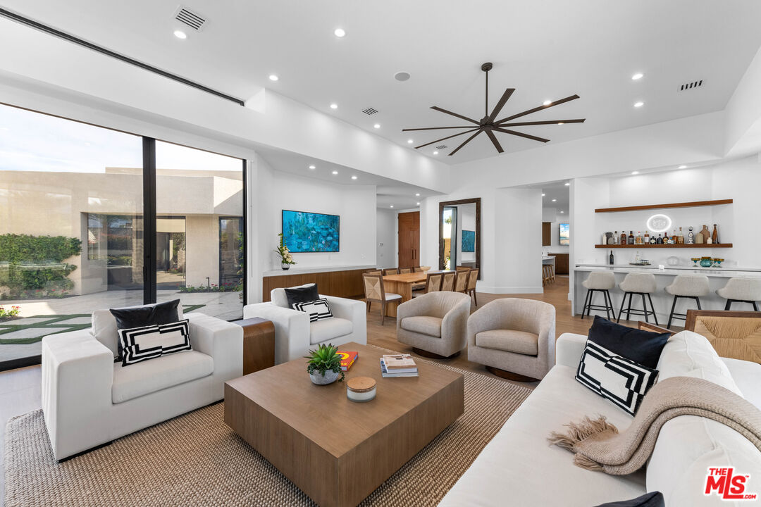 79400 Stonegate La Quinta, CA 92253 - Photo 7 of 46 a living room with furniture and a large window