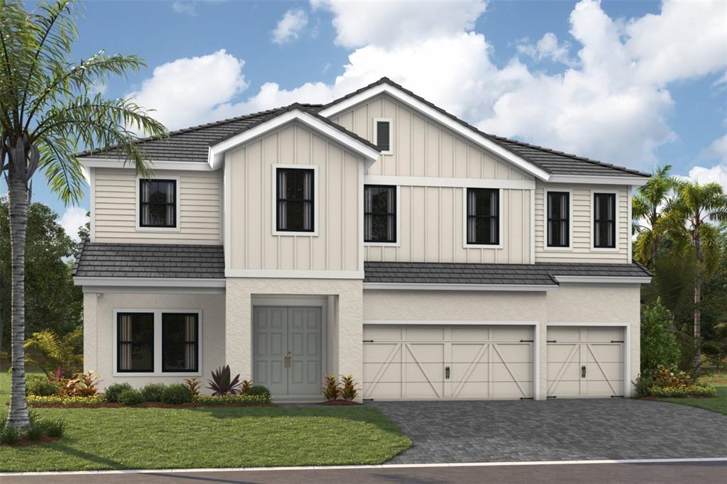 10821 Spring Sapling Circle Palmetto, FL 34221 - Photo 1 of 1 a front view of a house with a yard and garage