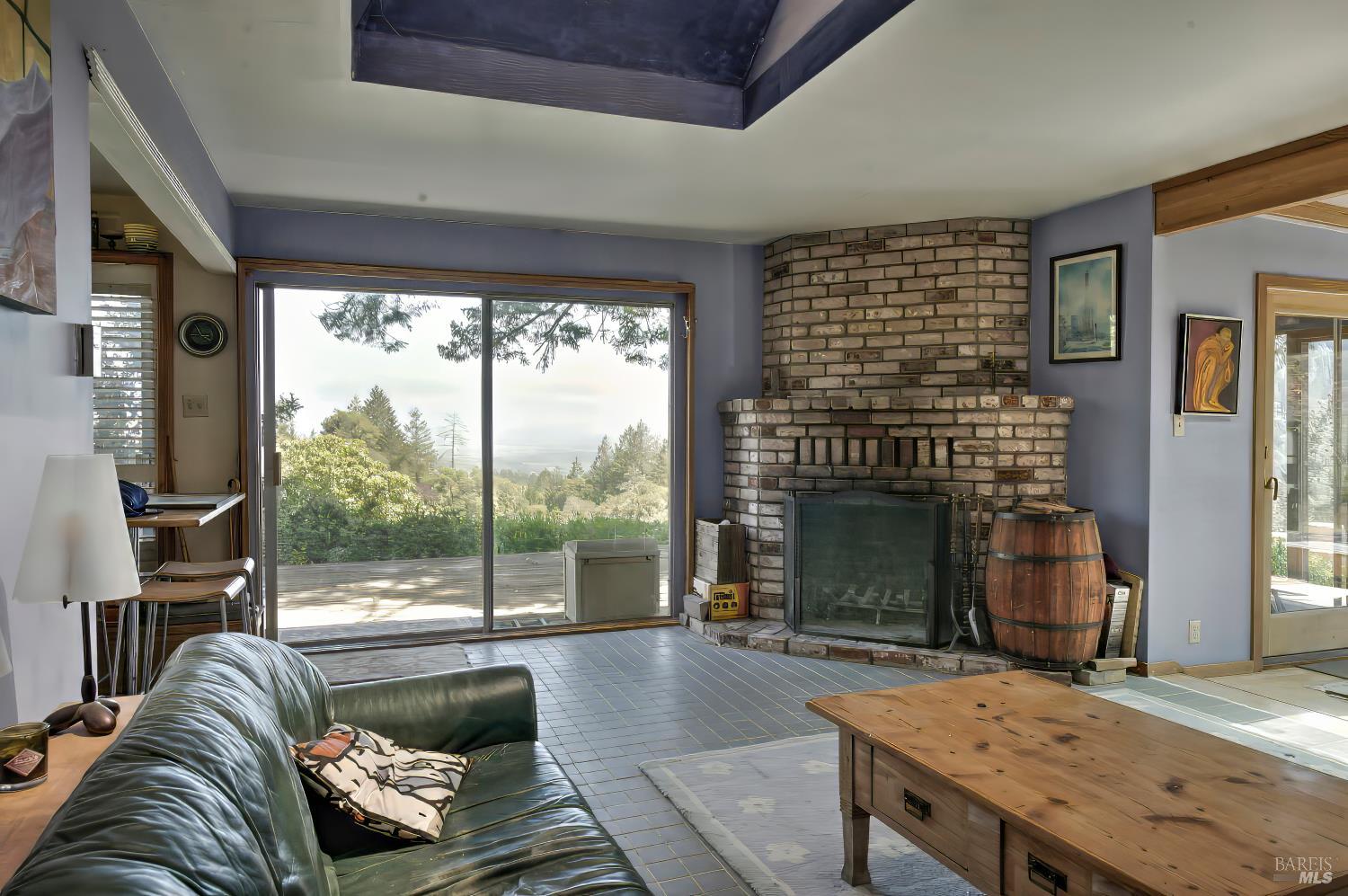 10957 Westside Road Healdsburg, CA 95448 - Photo 8 of 30 a living room with furniture and a fireplace