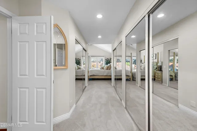 a bedroom with bed tv and a fireplace