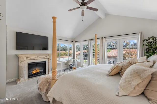 a spacious bathroom with a shower sink and mirror
