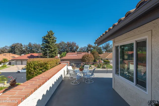 a bedroom with furniture and a flat screen tv