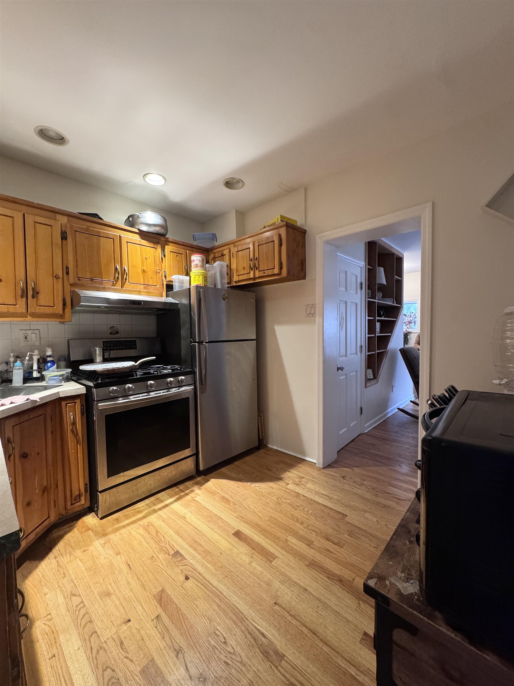 17 Green Court Lodi, NJ 07644 - Photo 20 of 21 a kitchen with granite countertop stainless steel appliances and wooden cabinets