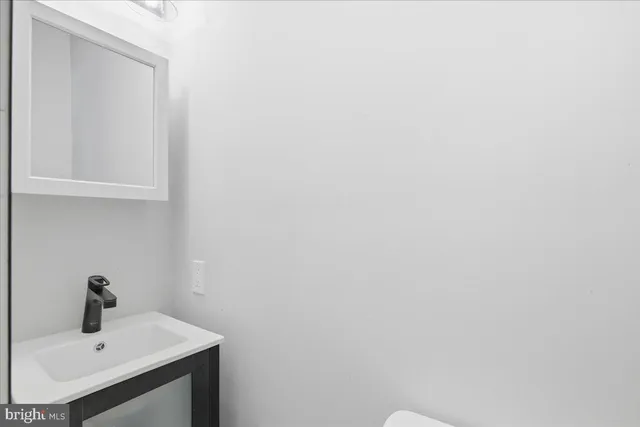 a bathroom with a sink and vanity