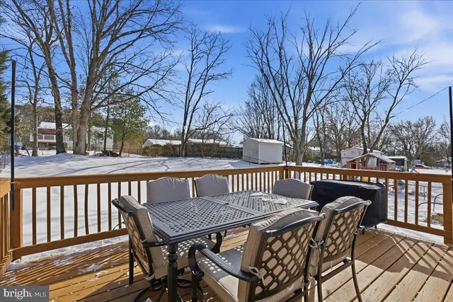 a view of a chairs and table on the deck