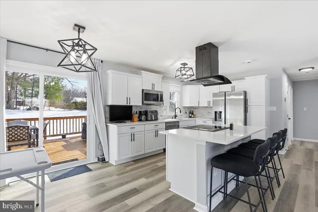 a very nice looking dining room with a table and chairs