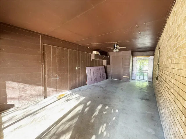 a view of a backyard with tub and door