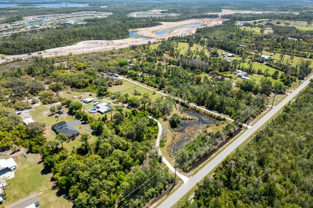 2727 Absher Road St. Cloud, FL 34771 - Photo 2 of 12 a view of a yard with plants