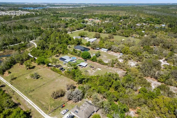 an aerial view of residential houses with outdoor space