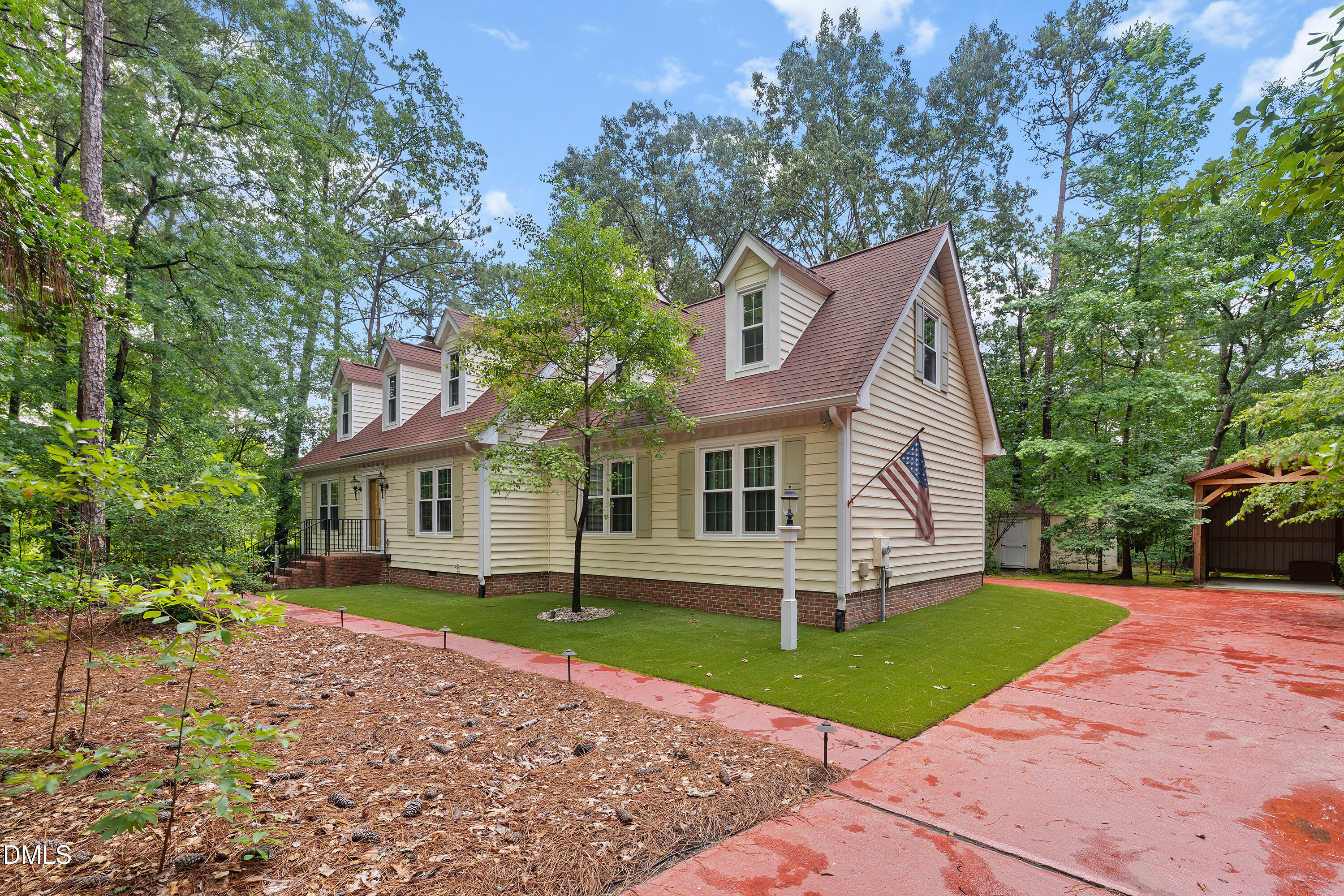 5216 Bridget Drive Raleigh, NC 27603 - Photo 1 of 30 a front view of a house with a garden