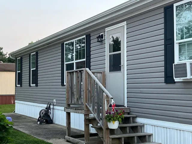 a view of front door and potted plants