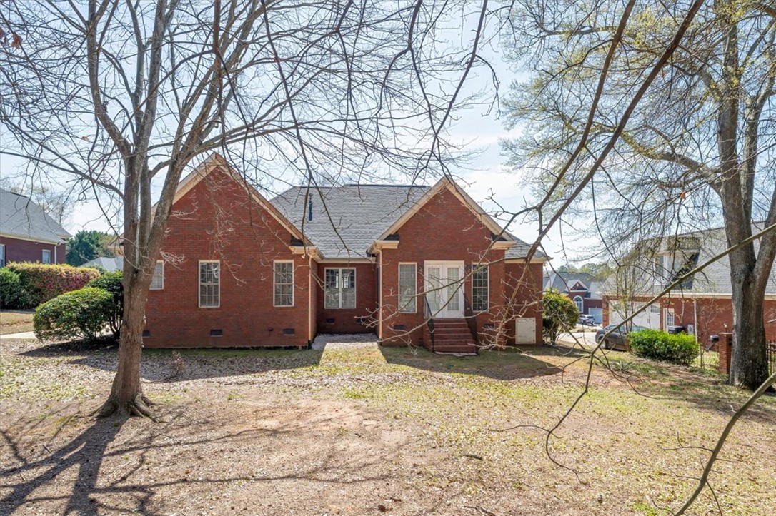 128 Cayman Way Anderson, SC 29621 - Photo 36 of 49 This classic brick residence features a durable shingle roof and a spacious private yard.
