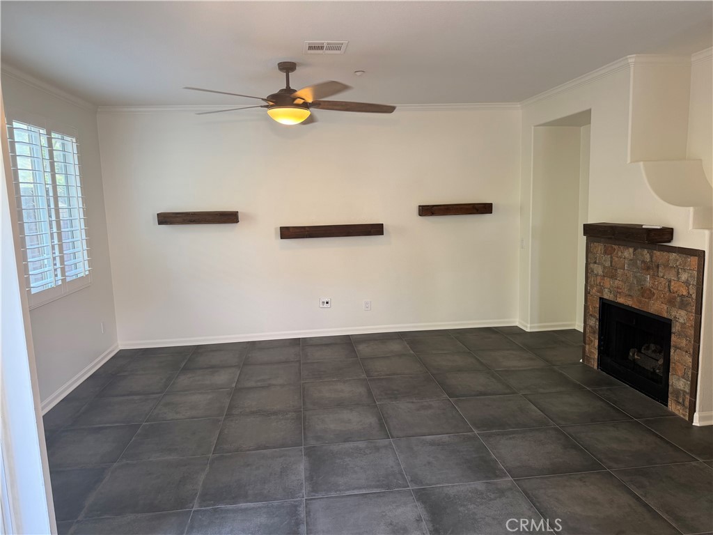 39246 Mango Bay, Unit B Murrieta, CA 92563 - Photo 3 of 29 Large living room with fireplace