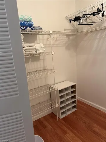 a view of room with wooden floor and chair