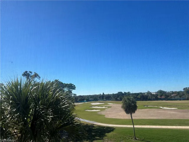 a view of a lake with a yard