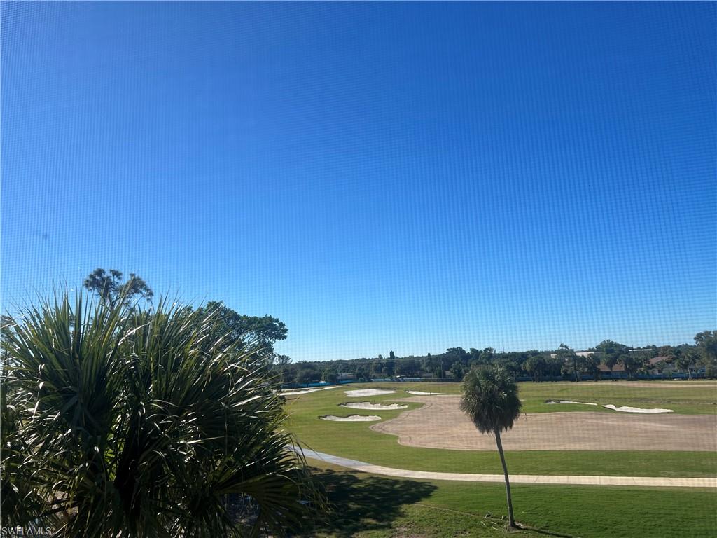4372 27th Court Southwest, Unit 403 Naples, FL 34116 - Photo 6 of 22 View of property's community with golf course view and a lawn