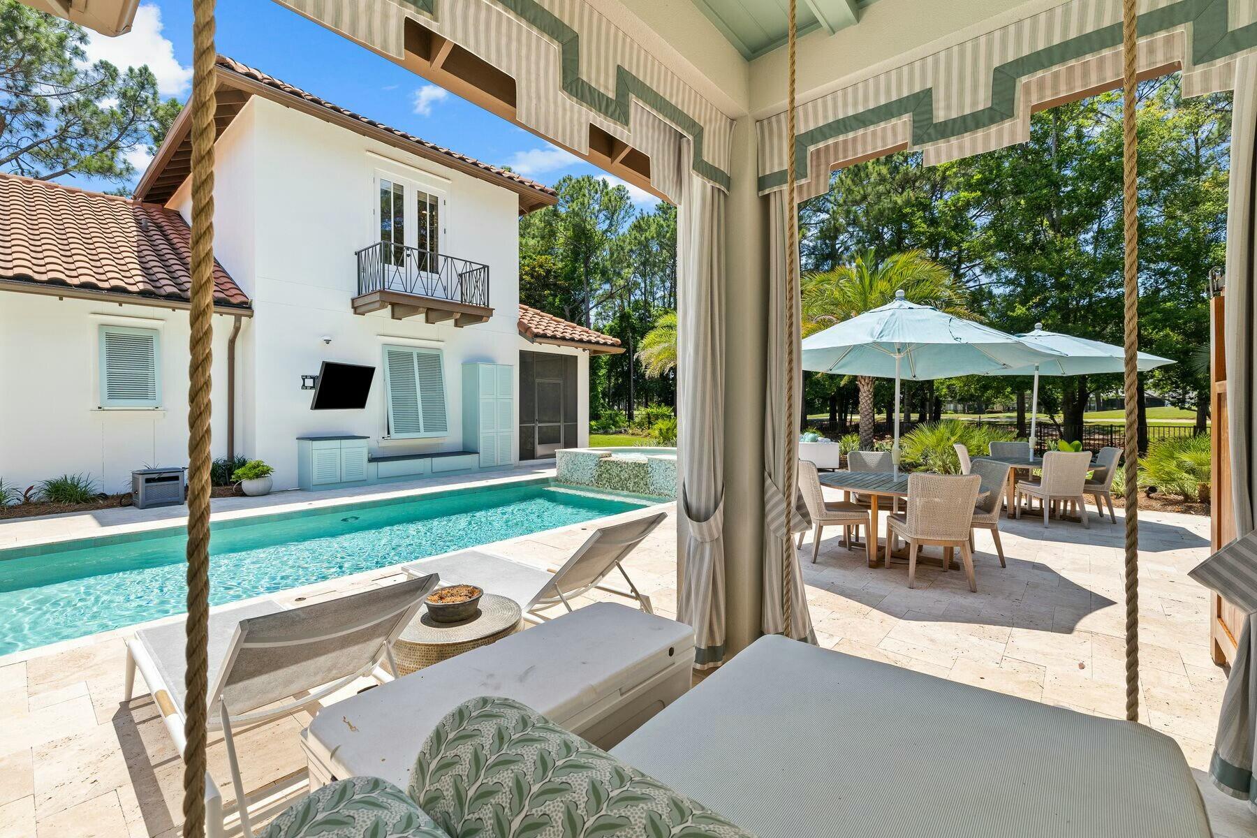 3121 Merion Drive Miramar Beach, FL 32550 - Photo 21 of 54 a view of a patio with couches chairs and backyard of the house