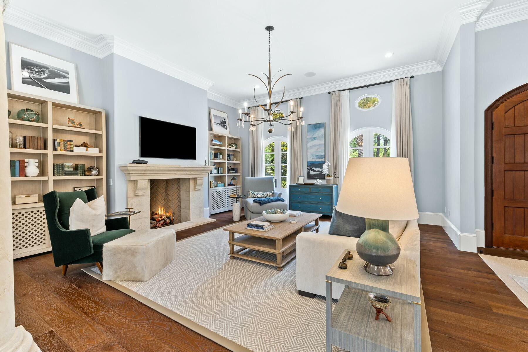 3121 Merion Drive Miramar Beach, FL 32550 - Photo 5 of 54 a living room with furniture a fireplace and a flat screen tv