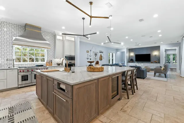 a kitchen with stainless steel appliances granite countertop a sink and cabinets