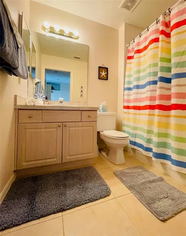 a bathroom with a sink a mirror and a toilet