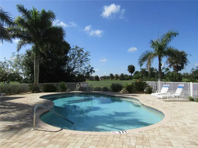 a view of a swimming pool with a patio