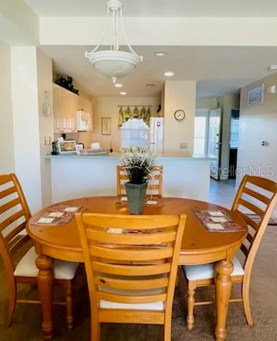 a dining room with a table and chairs