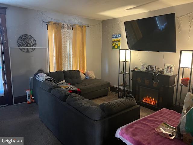 122 Arlington Street Reading, PA 19611 - Photo 5 of 15 a living room with furniture and a flat screen tv