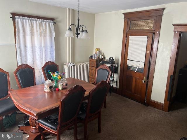 122 Arlington Street Reading, PA 19611 - Photo 7 of 15 a view of a dining room with furniture and a chandelier