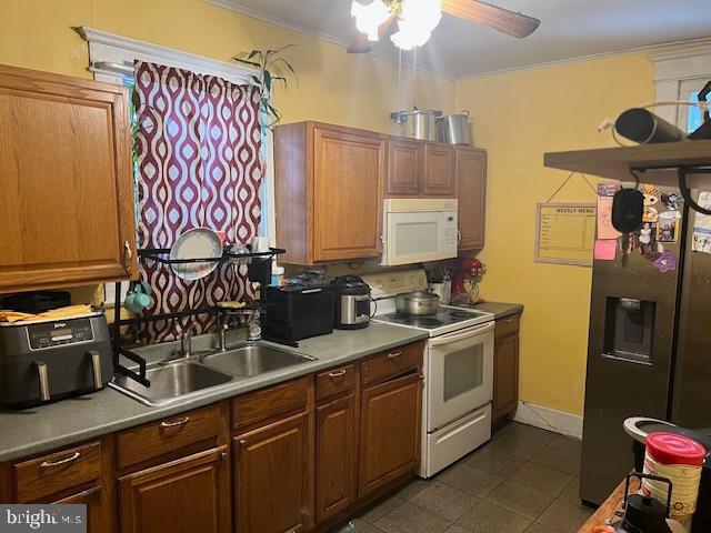122 Arlington Street Reading, PA 19611 - Photo 8 of 15 a kitchen with stainless steel appliances a sink and a refrigerator