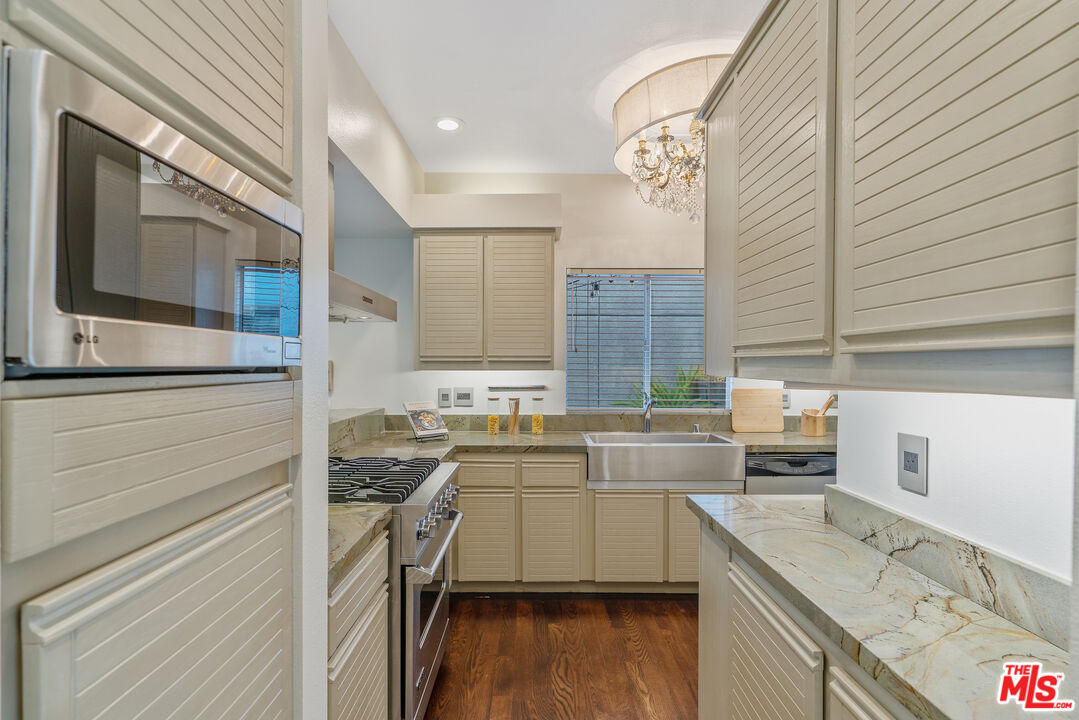 2131 Griffith Park Boulevard Los Angeles, CA 90039 - Photo 11 of 42 a kitchen with a sink a stove and cabinets