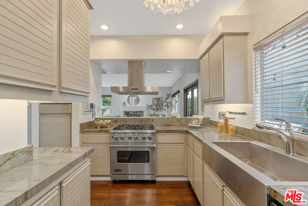 2131 Griffith Park Boulevard Los Angeles, CA 90039 - Photo 12 of 42 a kitchen with a stove sink and cabinets