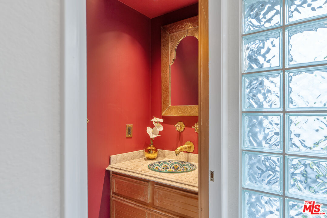 2131 Griffith Park Boulevard Los Angeles, CA 90039 - Photo 24 of 42 a bathroom with a granite countertop sink and a window