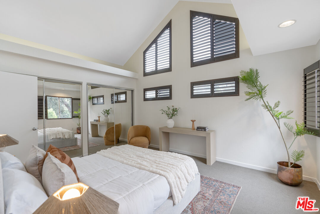 2131 Griffith Park Boulevard Los Angeles, CA 90039 - Photo 27 of 42 a bedroom with a bed and dresser with mirror