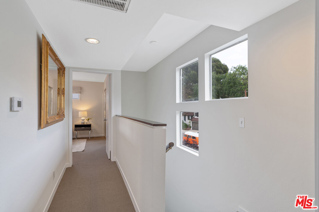 2131 Griffith Park Boulevard Los Angeles, CA 90039 - Photo 32 of 42 a view of a hallway with a white walls and stairs