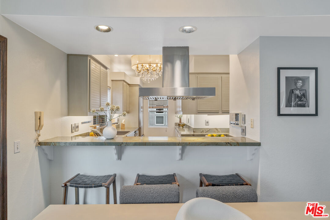 2131 Griffith Park Boulevard Los Angeles, CA 90039 - Photo 9 of 42 a kitchen with stainless steel appliances a sink and a large mirror