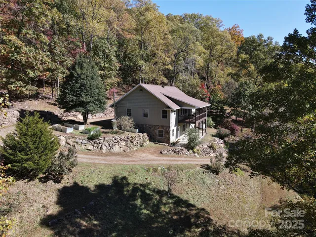 a view of house with yard