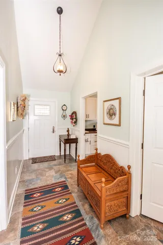 a kitchen with a stove a sink and cabinets
