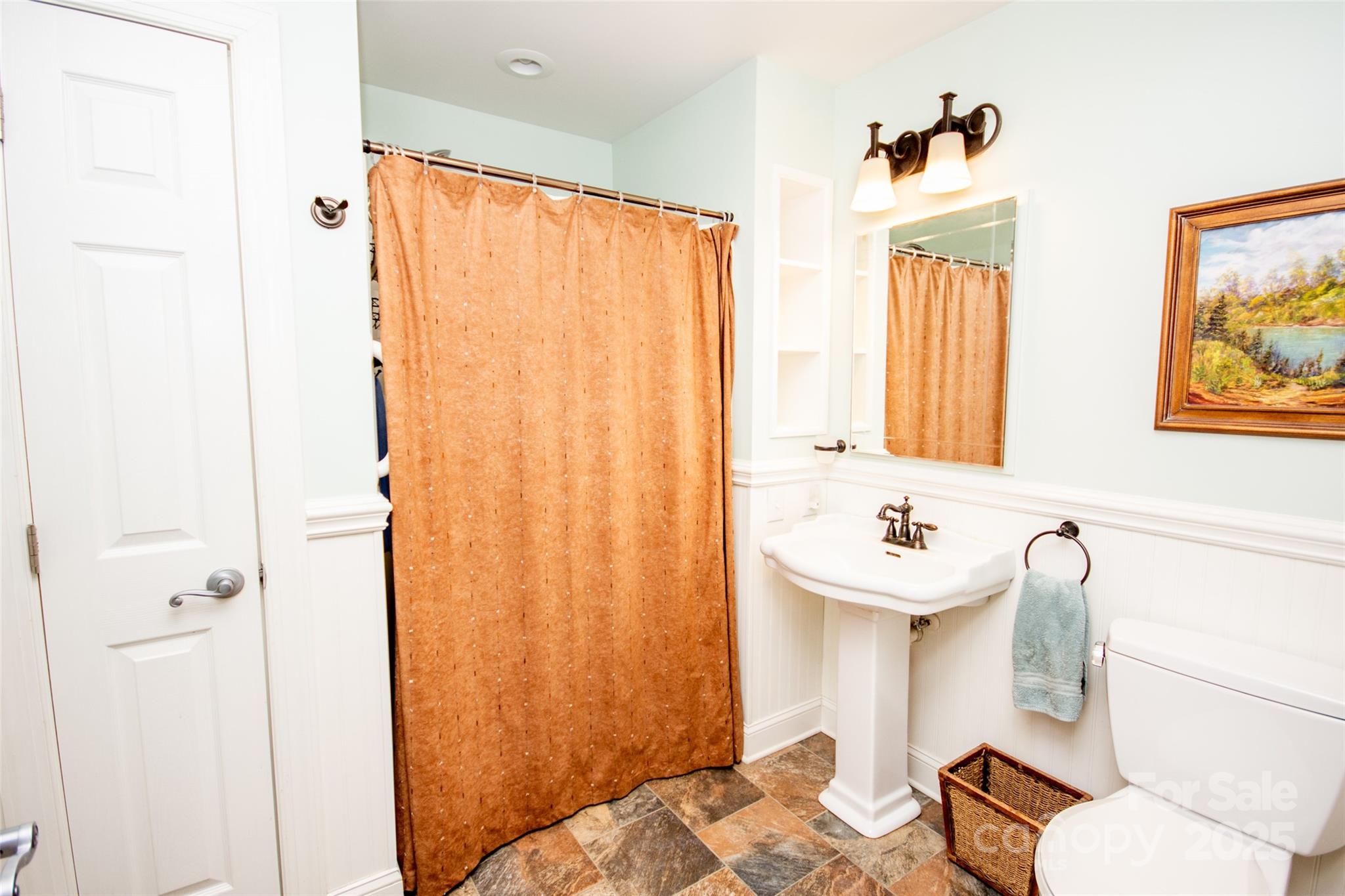 985 Roberson School Road Moravian Falls, NC 28654 - Photo 22 of 48 a bathroom with a sink and a mirror