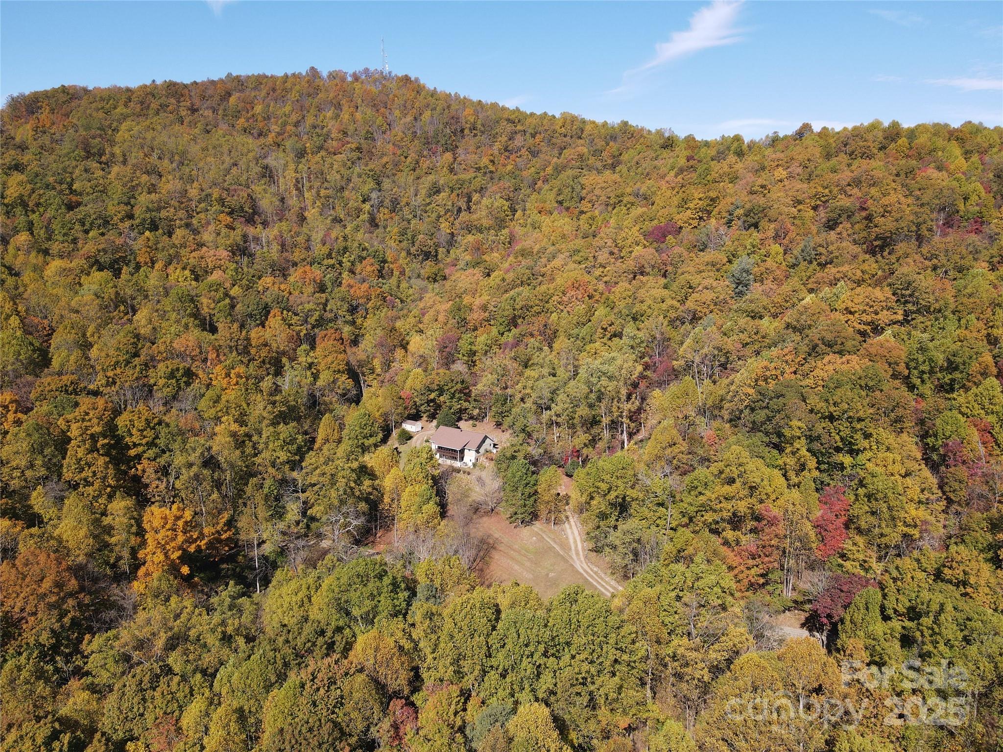 985 Roberson School Road Moravian Falls, NC 28654 - Photo 4 of 48 a view of a large building with mountains in the background
