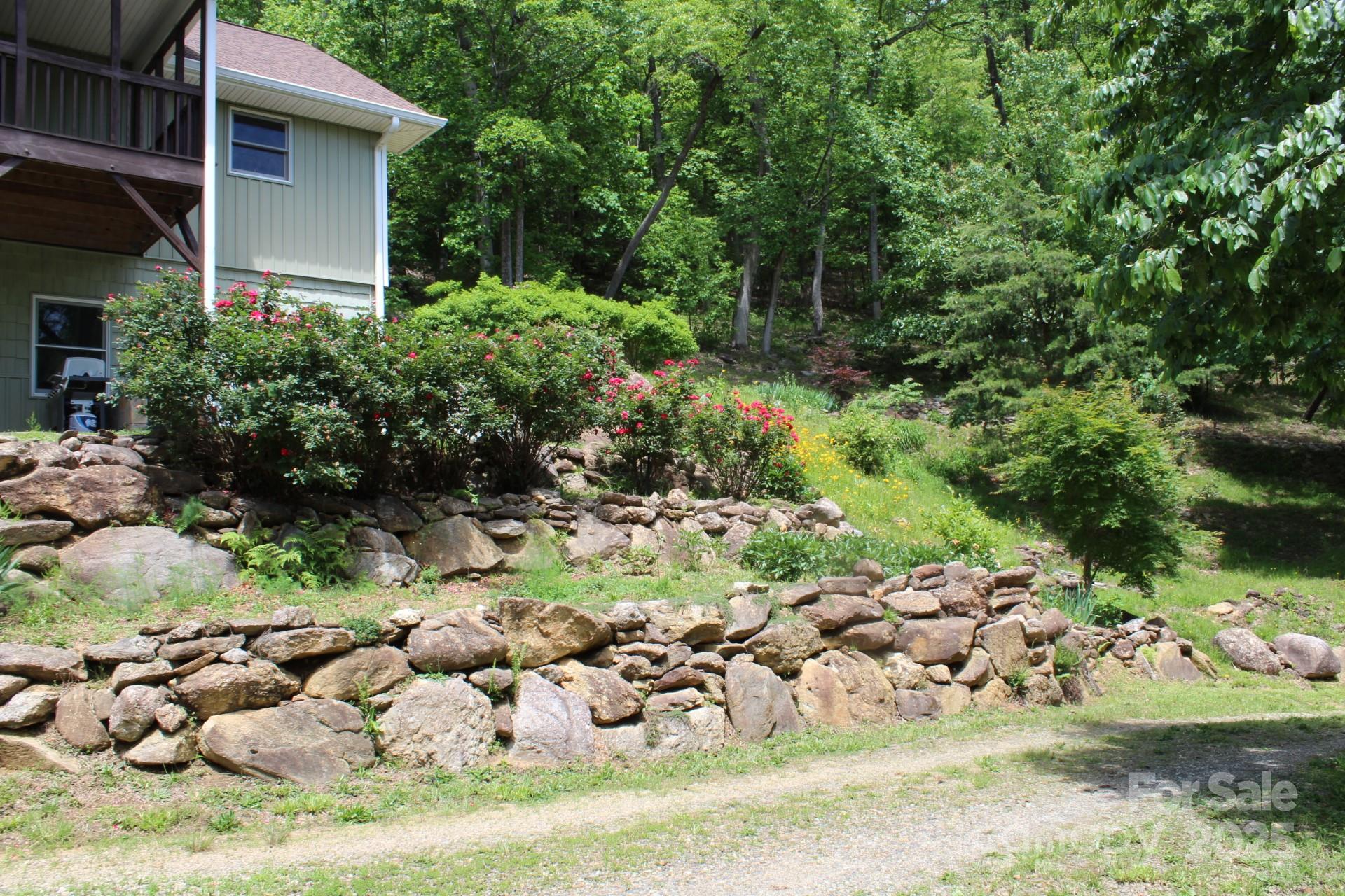 985 Roberson School Road Moravian Falls, NC 28654 - Photo 10 of 48 a view of a wooden house with a yard