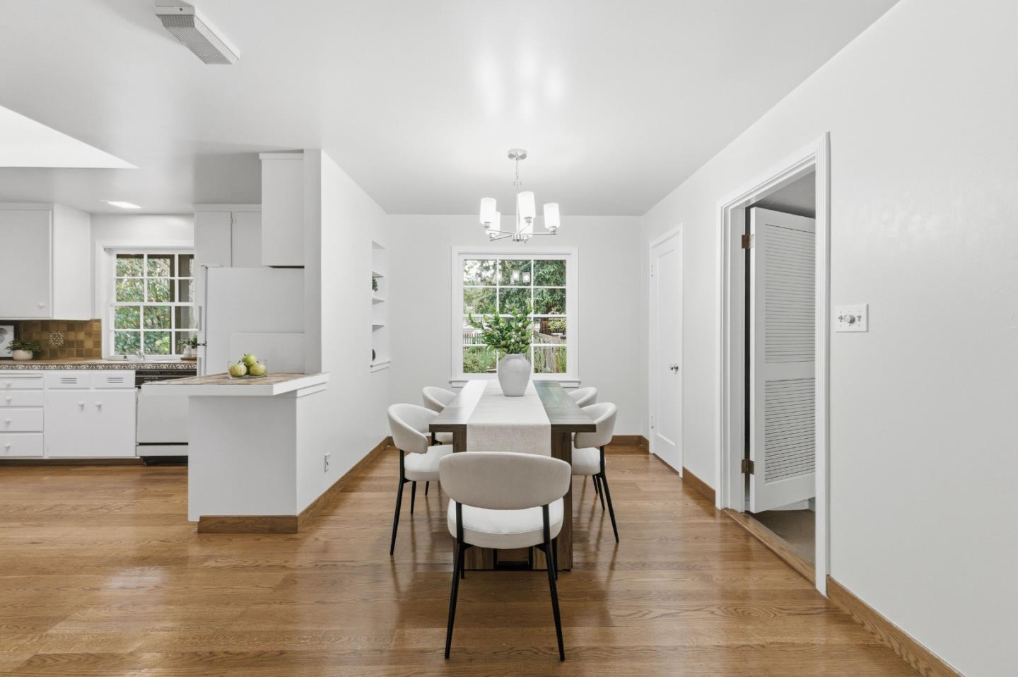 1698 Cordilleras Road Redwood City, CA 94062 - Photo 14 of 44 a view of a dining room with furniture window and wooden floor