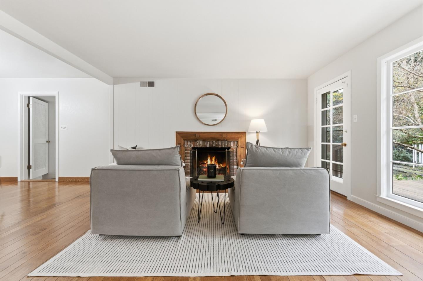 1698 Cordilleras Road Redwood City, CA 94062 - Photo 16 of 44 a living room with furniture and a fireplace