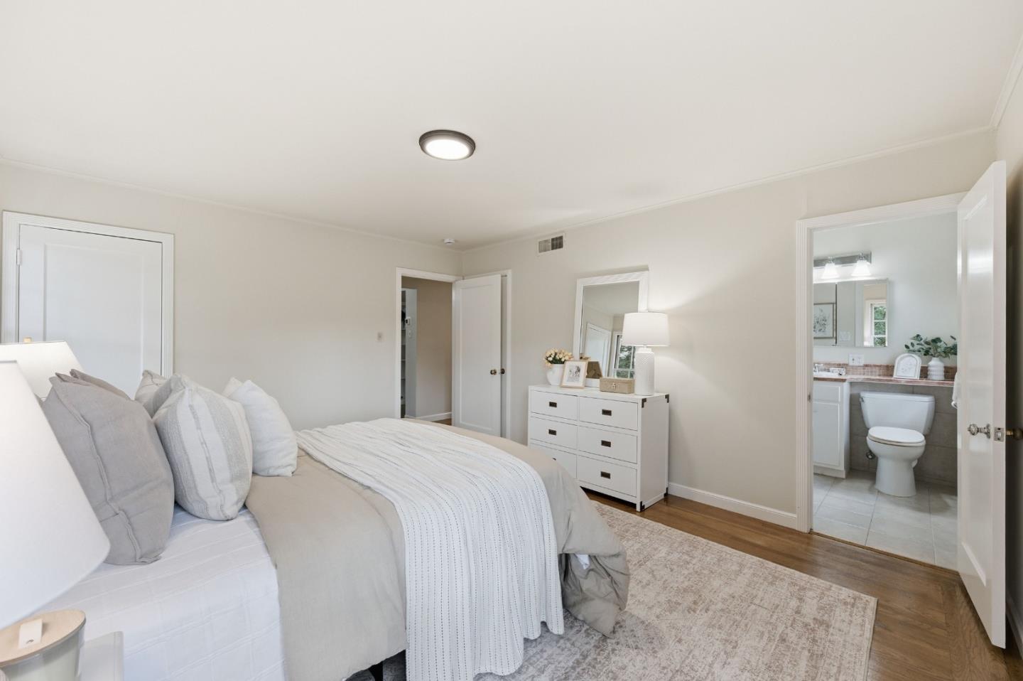 1698 Cordilleras Road Redwood City, CA 94062 - Photo 19 of 44 a bedroom with a bed and a couch
